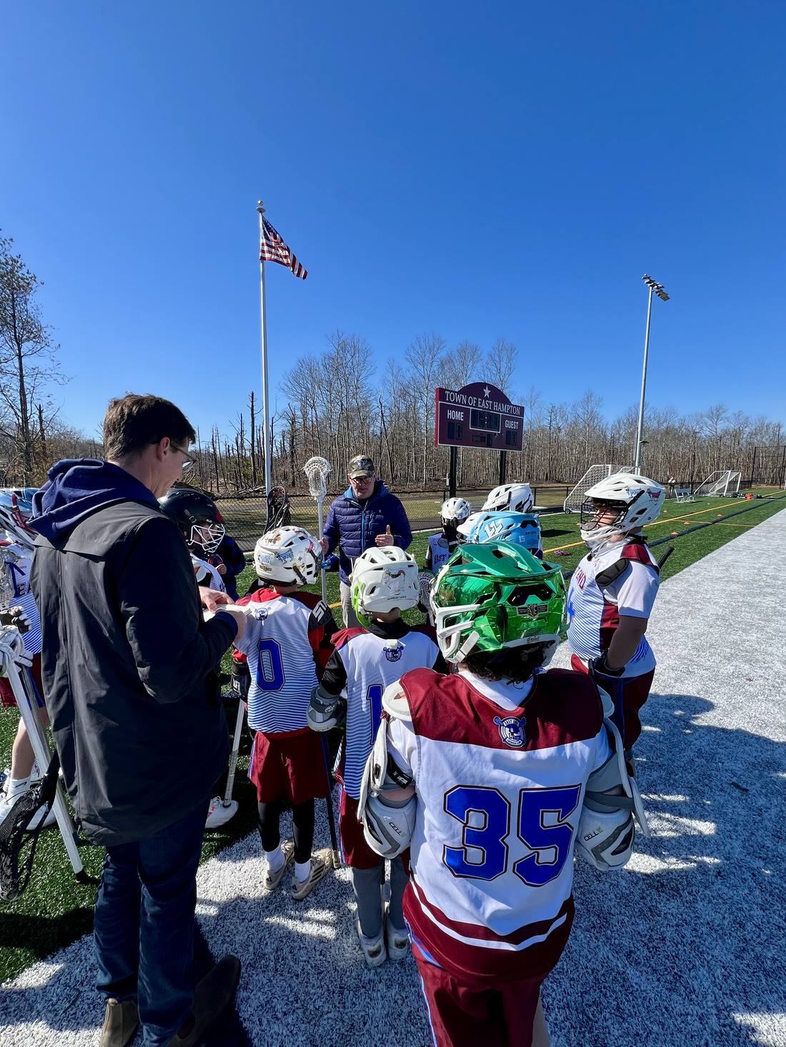 Coaches leading a huddle
